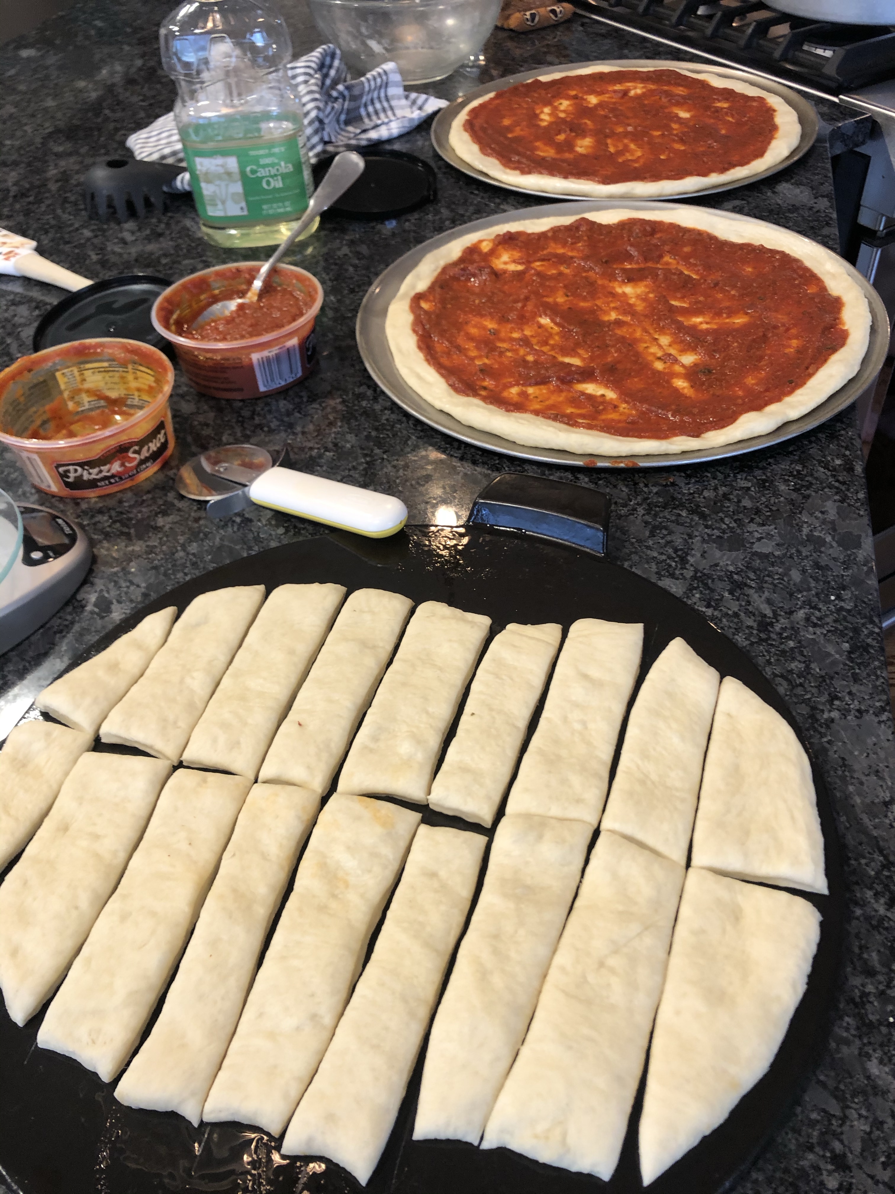 Apply the sauce with a spoon and spread it around leaving some crust showing.