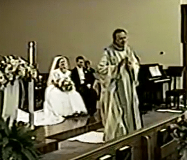 Me and Kathy listening to Father Mark's Homily at our wedding.